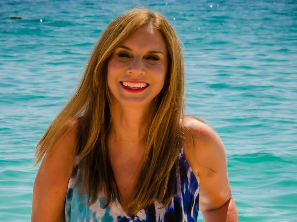 Julie walking out of water on beach