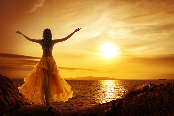 calm woman meditating sunset relax open arms pose