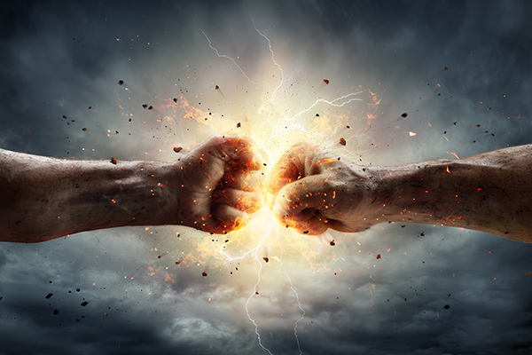 conflict concept two fists in impact